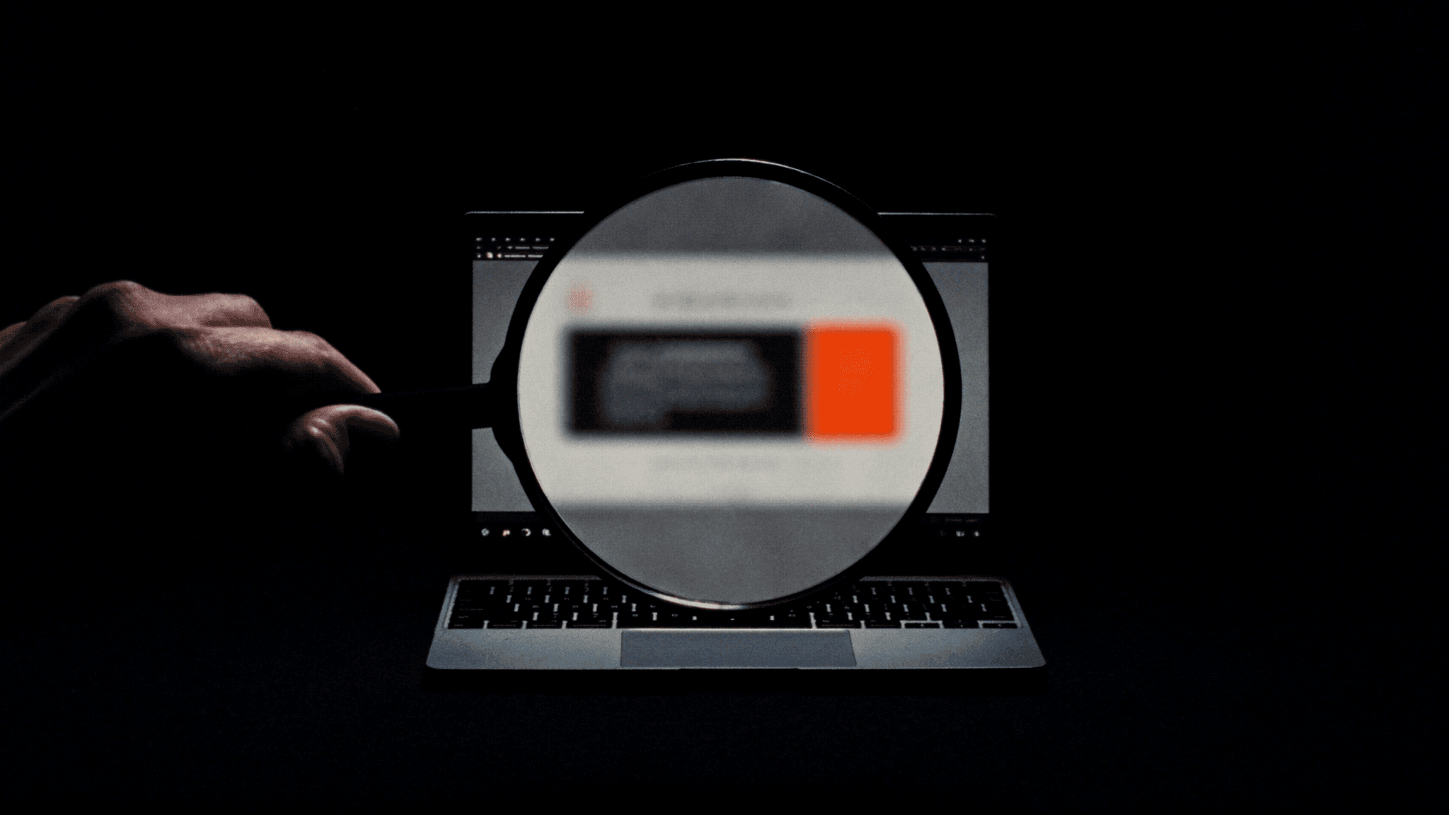 A magnifying glass examining a venue's website.