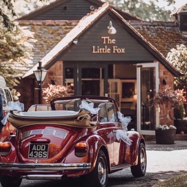 The Little Fox venue with a vintage wedding car outside